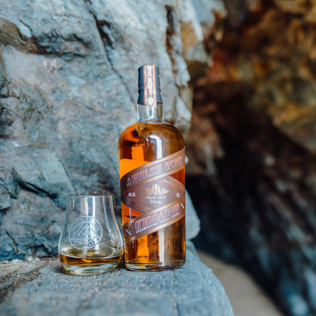 A bottle and glass of an In the Welsh Wind independent bottling