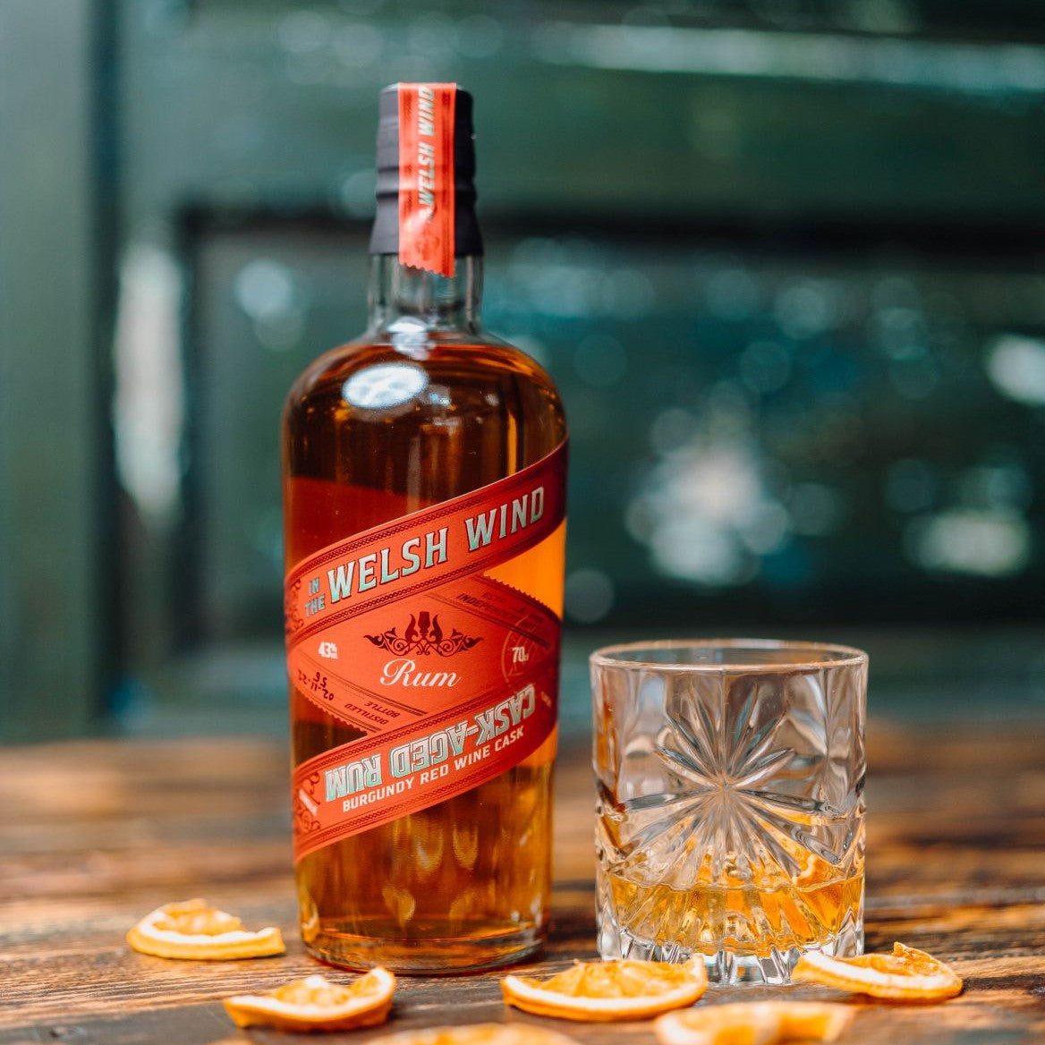 A bottle and glass of In the Welsh Wind cask-aged rum