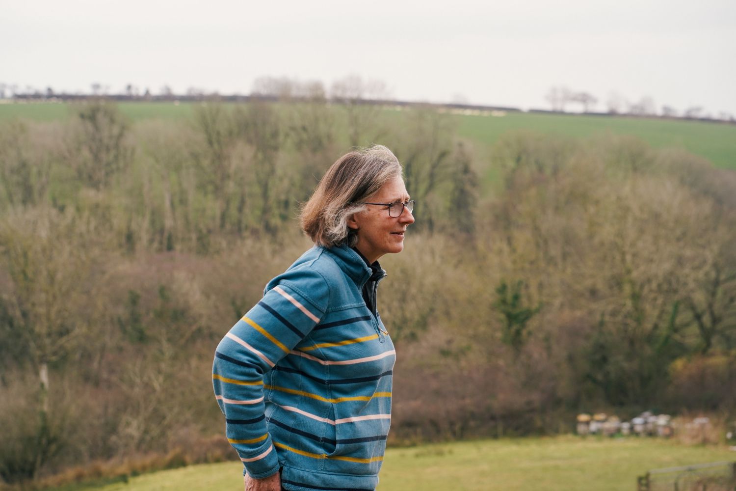 A lady standing on a hillside in west Wales