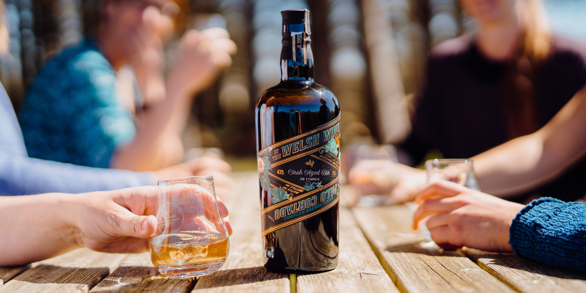 In the Welsh Wind Palo Cortado Cask Aged Gin - enjoyed by a group of friends over ice in the sunshine.