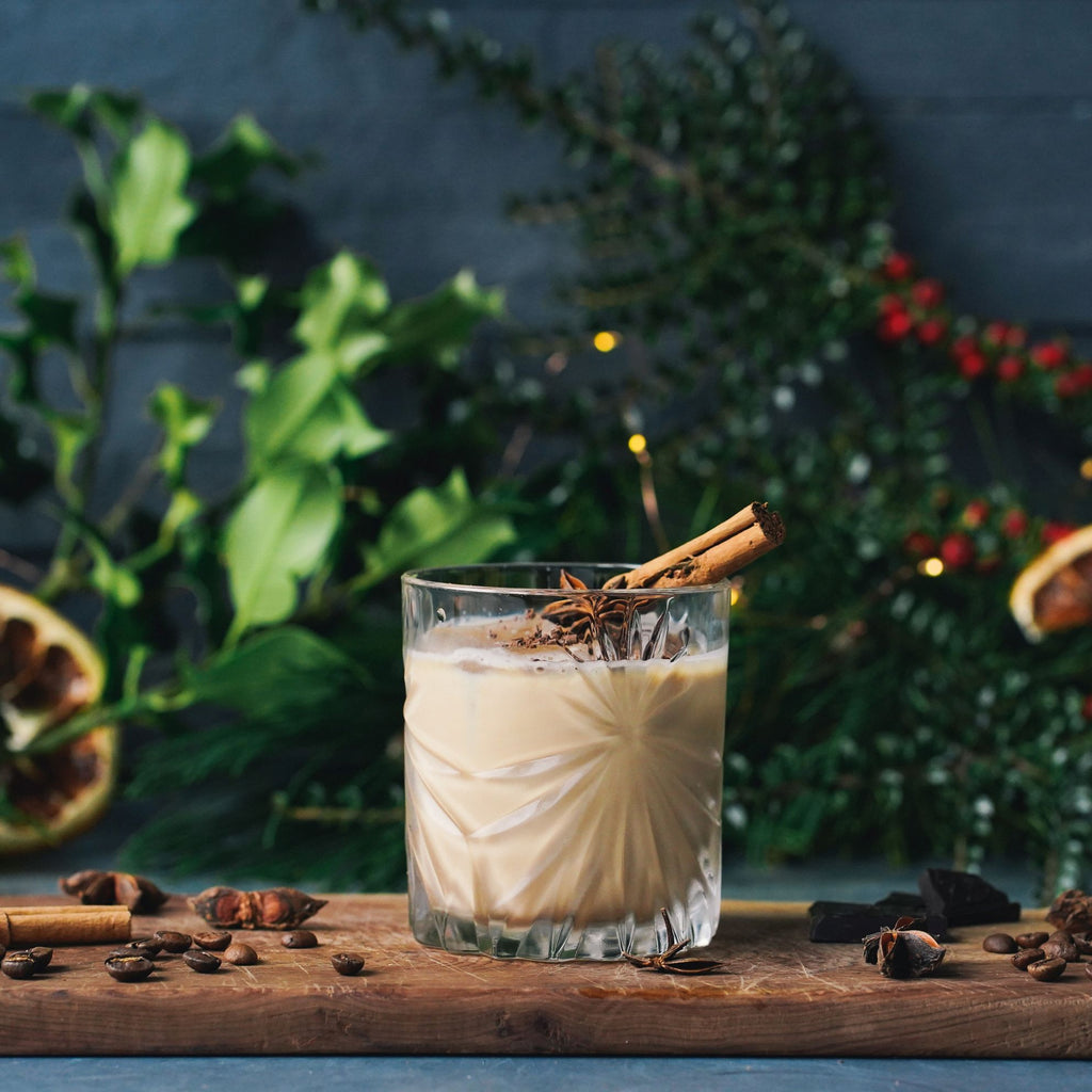 Creamy Welsh Christmas Coffee cocktail in a rocks glass with cinnamon stick and star anise garnish made with In the Welsh Wind Signature Style Welsh gin